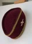 A Burgundy and Gold Ceremonial African Traditional Hat