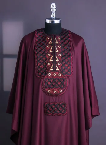 A Burgundy, Connected Ring With Gold Eyelet Details Agbada